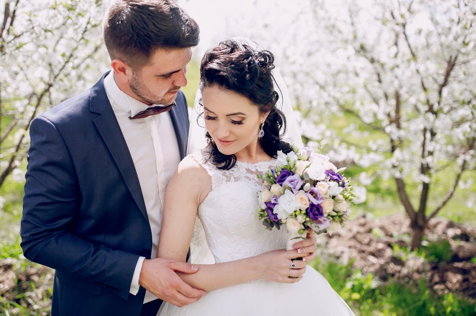 Bride entering luxury wedding limo in Boston